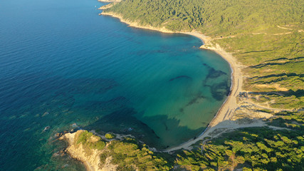 Aerial drone photo of secluded emerald beach of Krifi or "hidden beach" in island of Skiathos, Sporades, Greece