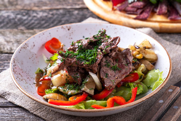 Salad with beef and vegetables on a plate