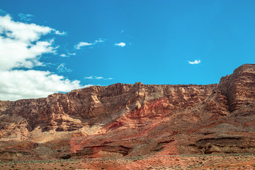 Beautiful shades of brown and red mountain contrasted by the blue sky - AZ, USA