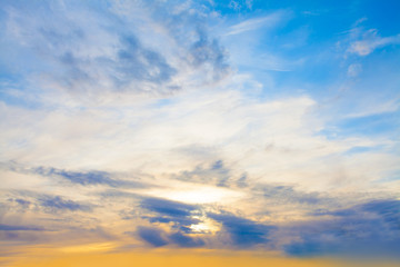 Naklejka na ściany i meble Sunset sky clouds background. Beautiful landscape with clouds and orange sun on sky