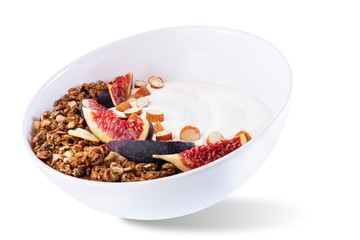 Greek yogurt chocolate nuts oatmeal granola with figs on a white isolated background