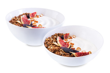Greek yogurt chocolate nuts oatmeal granola with figs on a white isolated background