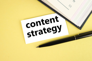 content strategy. text on white paper on yellow background