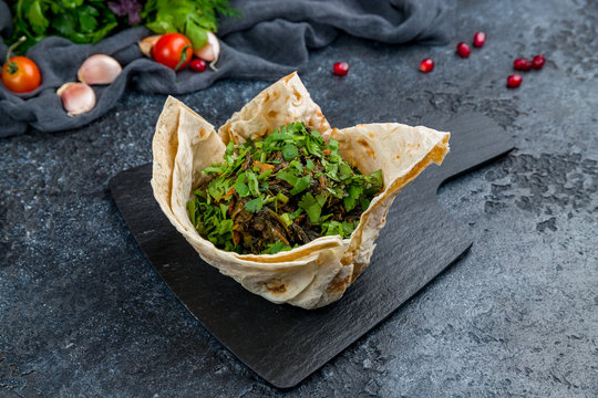 Aveluk Armenian cuisine on black stone table