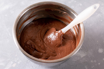 Preparing chocolate dough for pie