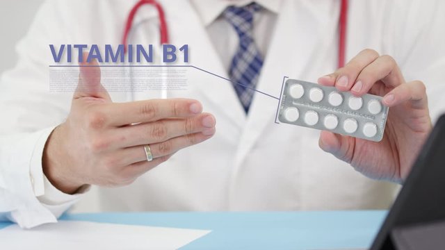 Vitamin b1 blister pack with tablets in doctor's hand