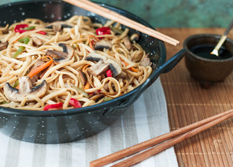 Traditional chinese food. Stir fried noodles with vegetables. Close up. Food Background.