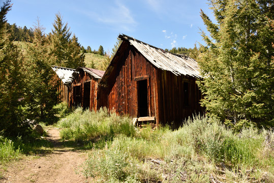 Abandoned mining cabins in old ghost town in Idaho mountains