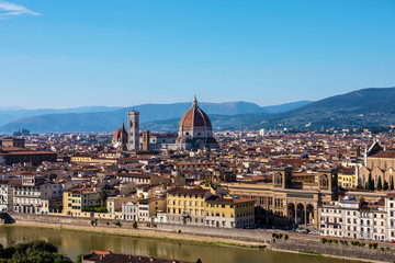 Fototapeta na wymiar Picturesque view of Florence - Duomo Cathedral and Arno River from Michelangelo Square, Italy. Selective focus. 