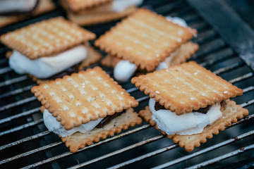 Toasted Smores with marshmallows and chocolate on the grill