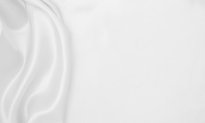 Fototapeta premium Smooth elegant white silk or satin luxury cloth texture as wedding background. Luxurious background design