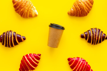 Set of coffee with croissants - chocolate, berry, classic - on blue stone table