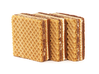 Sandwich wafers with milk cream filling, hazelnuts and chocolate spread isolated on white	
