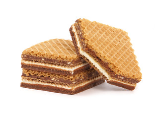 Sandwich wafers with milk cream filling, hazelnuts and chocolate spread isolated on white