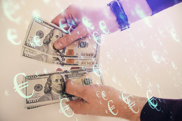 Multi exposure of financial graph drawing hologram and USA dollars bills and man hands. Analysis concept.