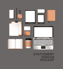 laptop tablet and mockup set on gray background of corporate identity and stationery design theme Vector illustration © Grgroup
