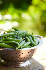 fresh green peas on wooden surface