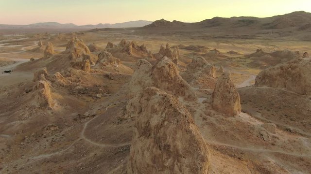 Trona Pinnacles In Mojave Desert California Sunset Over Rock Formations Aerial Shot Rotate L