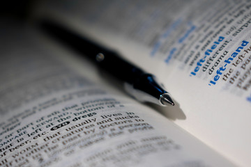 dictionary with pen