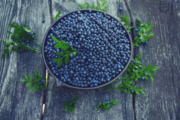 wild blueberries on rustic wooden surface