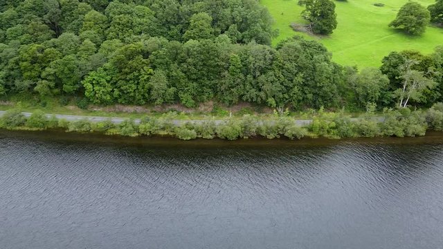 View of a Lake District lake side road, Aerial pan right