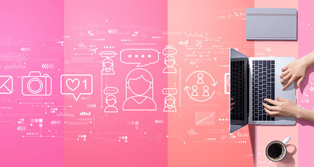 Social media theme with person working with a laptop