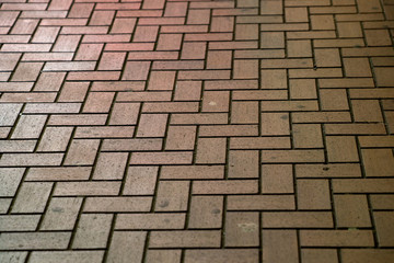 a brown brick sidewalk