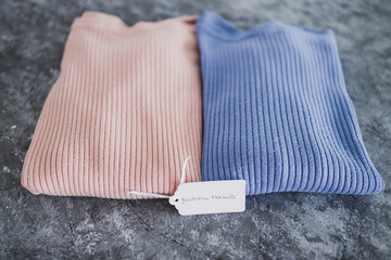 shopping concept, knit jumpers in alternative colours with Fashion Trends text on price tag