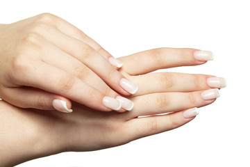 Female hands with woman's professional natural frenchnails manicure on white background