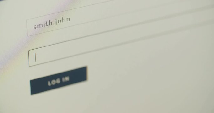 Extreme closeup shot - typing user name and password on a computer.