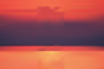 Motion blur tropical sunset beach with a background of abstract ocean waves bokeh sun light. Copy the summer vacation room and business travel concept. Antique tone color filter style.