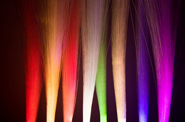 colorful optical fibres dinamic flying from deep on technology background