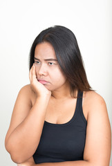 Fototapeta premium Portrait of young overweight Asian woman against white background