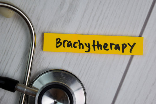 Brachytherapy text on sticky notes with office desk. Healthcare/Medical concept