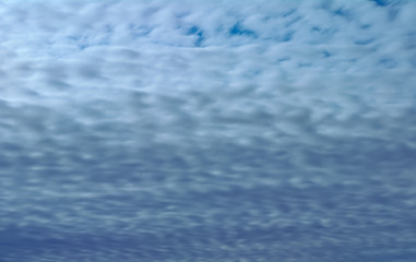 Blue sky texture with braid shaped clouds