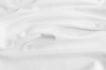 Obraz premium White abstract wavy clothes background. fabric texture