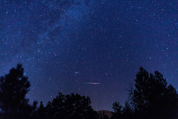Fototapeta na wymiar Perseid Meteors with the Milky Way Galaxy during the Perseids Meteor Shower.