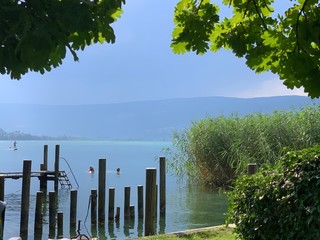 A view on the lake with wooden posts, a Thunderstorm coming 