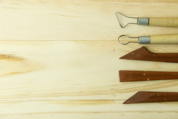 sculpture tools on wood for education and art content.