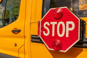 parked school bus with stop sign landscape