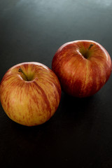 red apples on black background