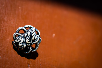 Macro of a button on the table 