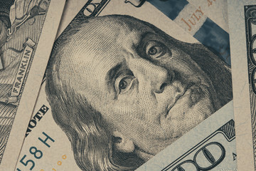 Closeup portrait of Benjamin Franklin on hundred dollar bill