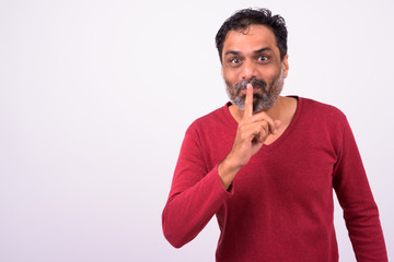 Portrait of mature handsome bearded Indian man