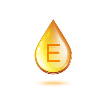 Vitamin E golden oil drop isolated on white background