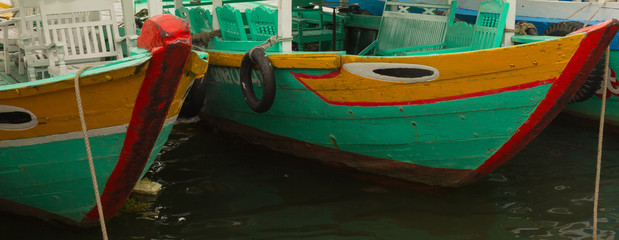 Fototapeta na wymiar Colorful traditional tour boats moored along the river in Hoi An Vietnam