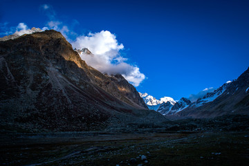 Fototapeta premium View of snowcapped Hamta Pass, the Deseret valley on the Pir Panjal range in the Himalayas. It is a small corridor between Lahaul and Kullu valley of Himachal Pradesh, India.