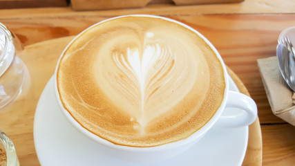 cup of coffee on wooden table