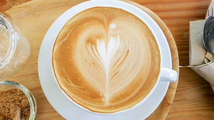 cup of coffee on wooden table