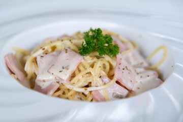 Closeup spaghetti carbonara in white plate